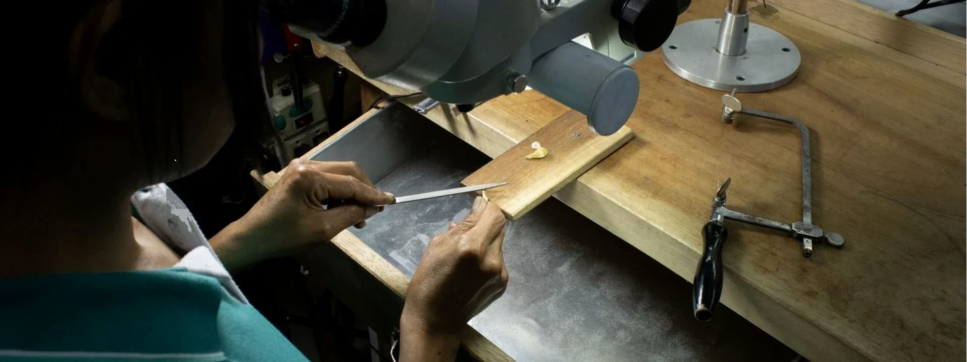 Jeweller's hands at the workbench, Amanda Jewellery Bangkok atelier