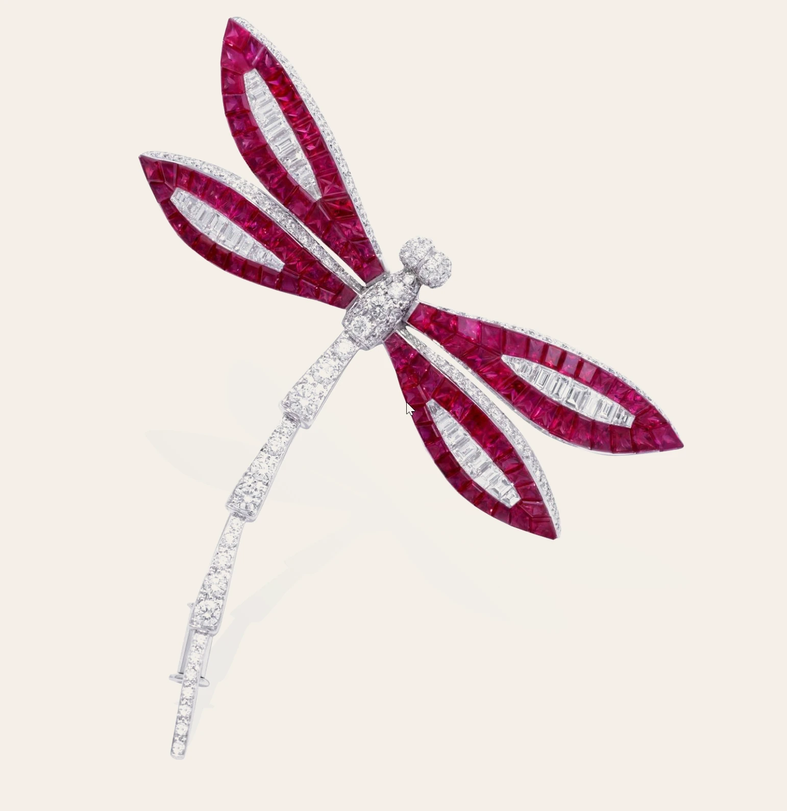 A dragonfly brooch set with invisible-set rubies and diamonds in white gold