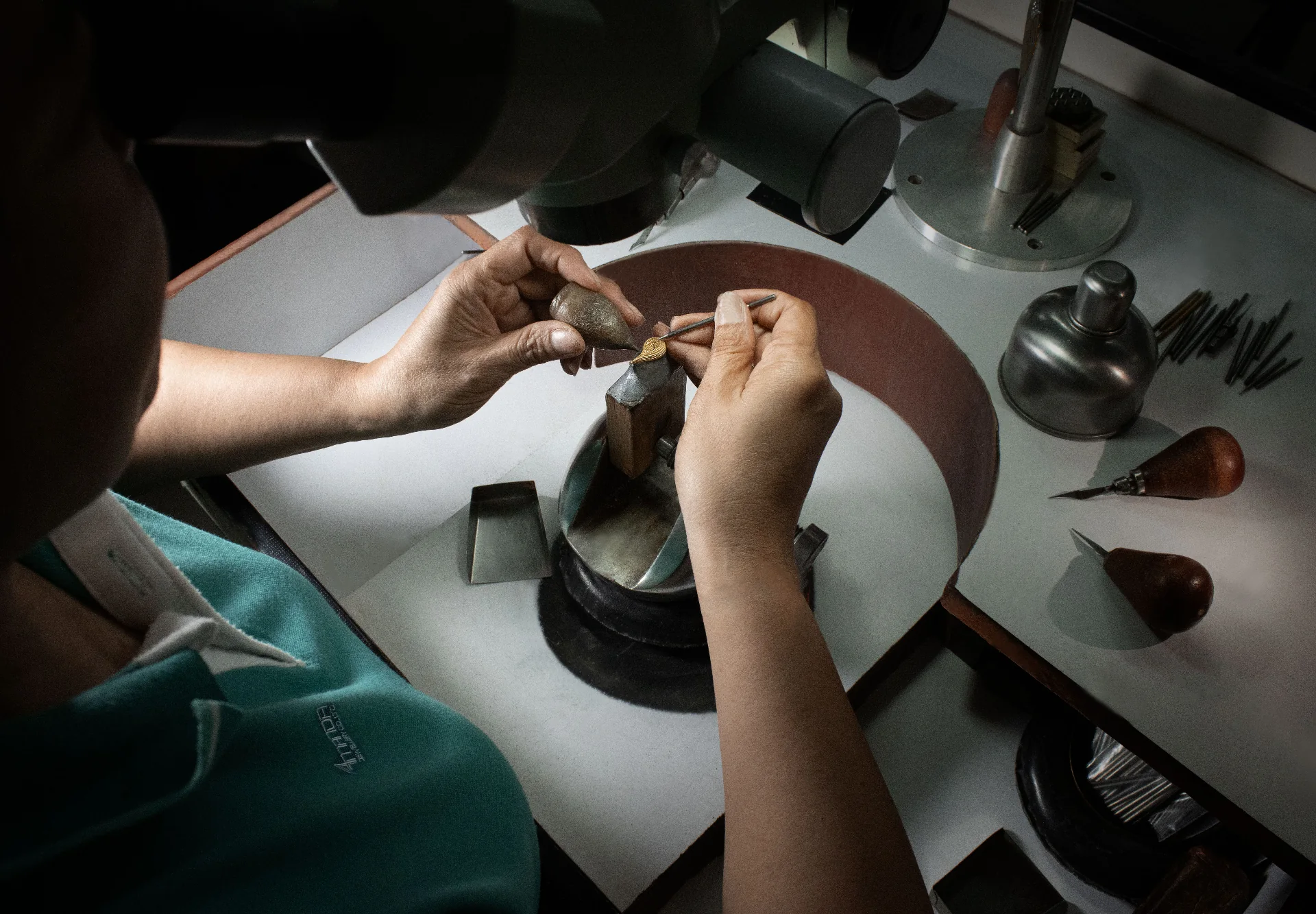 Amanda Jewellery setter at work with precision tools at the Bangkok atelier bench