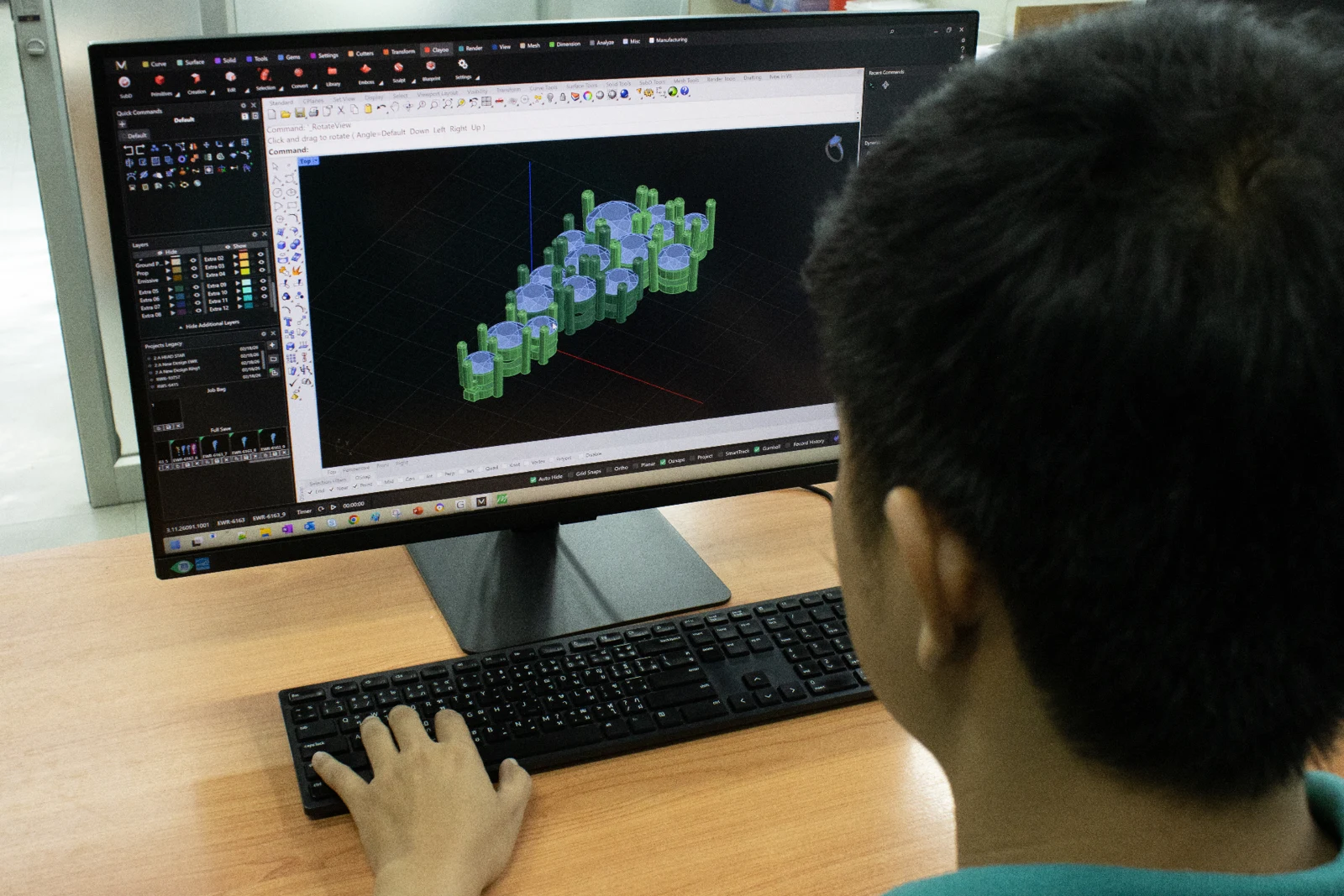 CAD designer modelling a jewellery piece in Rhino at the Amanda Jewellery Bangkok atelier